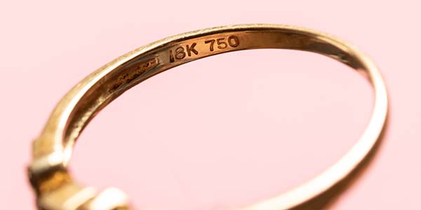 Image representing purity and assay marking on a gold ring.